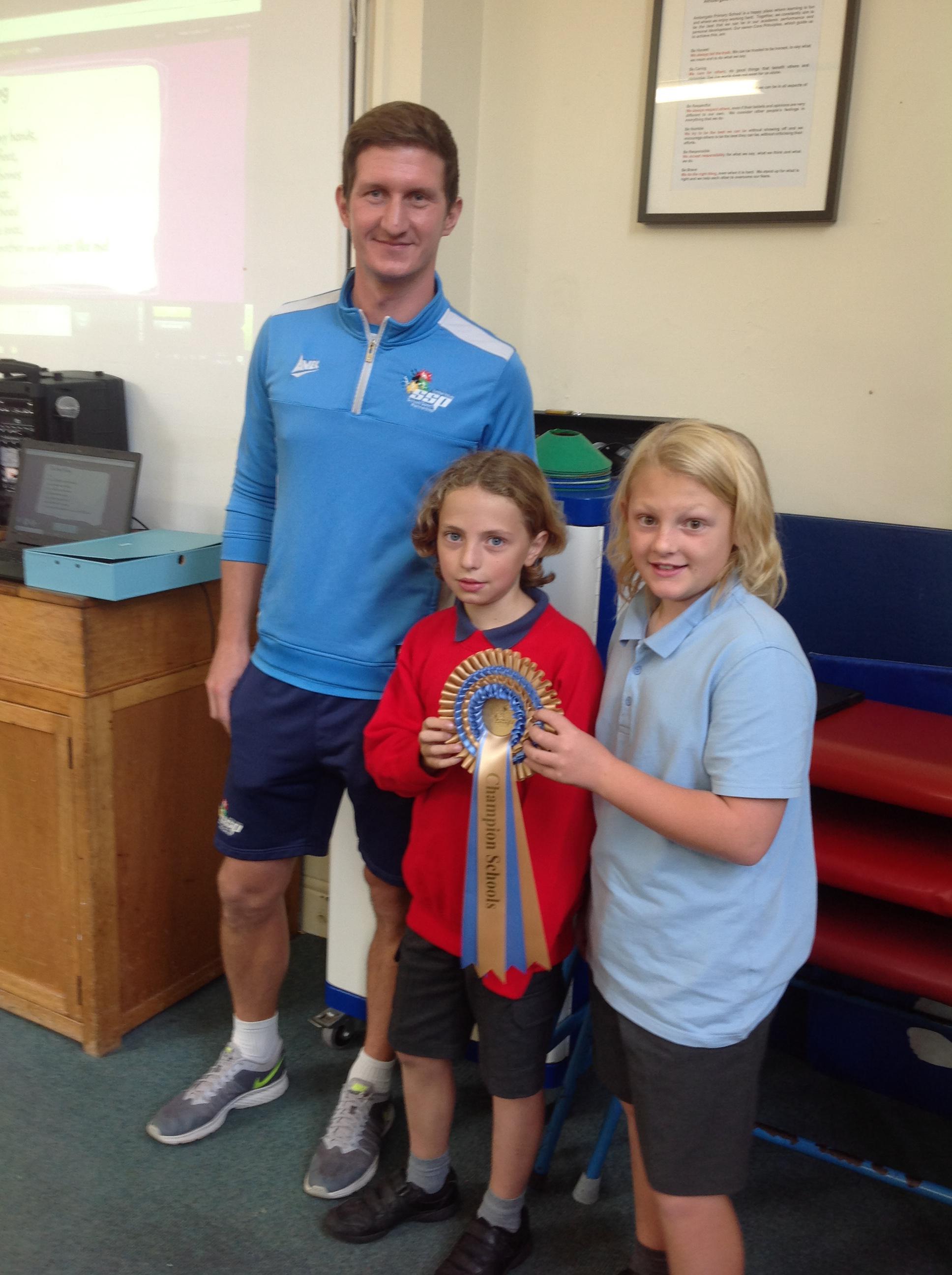 Children receiving the Champions Rosette.